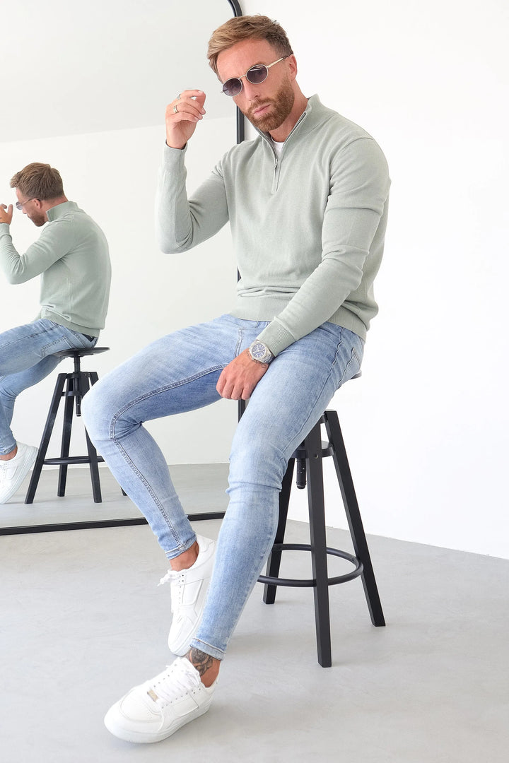 THE SANTONI QUARTER ZIP SWEATER
