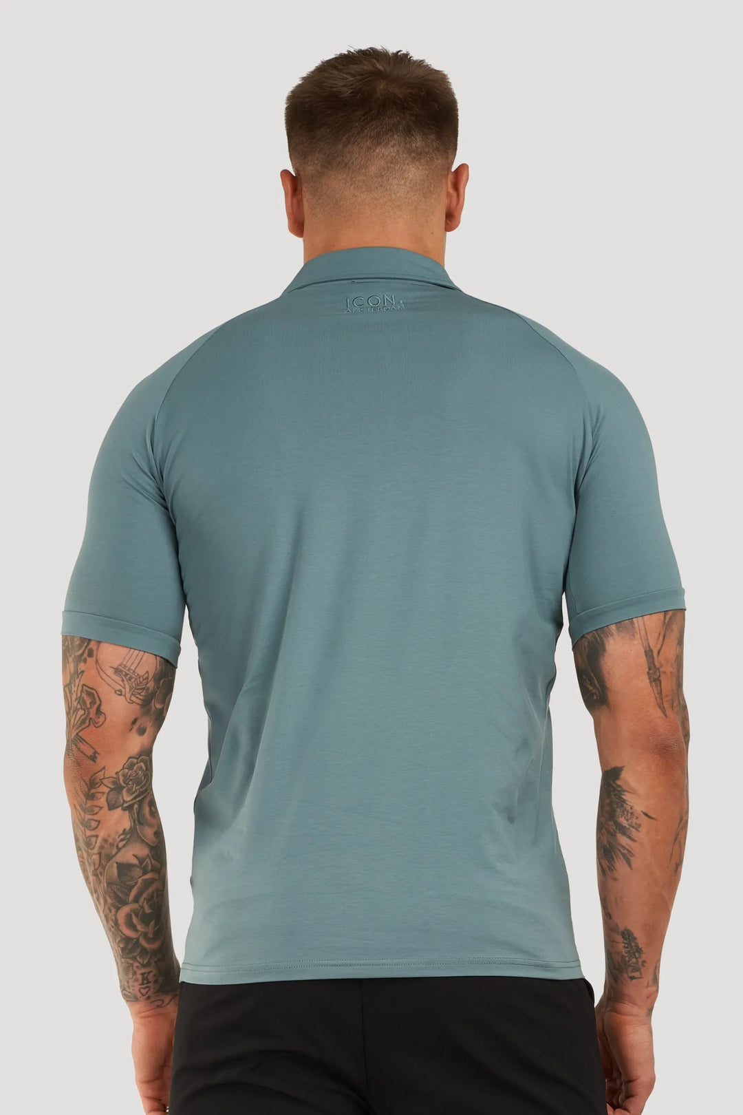 THE MUSCLE BUTTON POLO